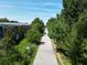 Scenic outdoor view of a paved path between lush green trees and buildings at 1052 Donnelly Sw Ave, Atlanta, GA 30310