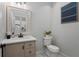 Tastefully designed powder room featuring a vanity with modern fixtures and decorative accents at 1052 Donnelly Sw Ave, Atlanta, GA 30310