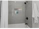 Modern shower with gray subway tile, a rainfall shower head, and a convenient built-in niche at 1052 Donnelly Sw Ave, Atlanta, GA 30310