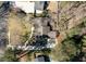 An aerial view showcasing the home's layout, mature trees, and landscaping at 1716 N Springs Dr, Atlanta, GA 30338