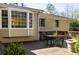 Inviting backyard wooden deck featuring a seating area adjacent to the house, perfect for outdoor living at 1716 N Springs Dr, Atlanta, GA 30338