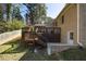 An expansive two-level backyard deck with stairs leading to the lawn at 1716 N Springs Dr, Atlanta, GA 30338