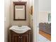 Cozy half-bathroom offering stylish fixtures and a decorative mirror at 1716 N Springs Dr, Atlanta, GA 30338