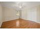 Bedroom with hardwood floors, trim, and natural lighting, perfect for relaxation at 1716 N Springs Dr, Atlanta, GA 30338