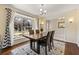 Bright dining room with a large window and modern table set at 1716 N Springs Dr, Atlanta, GA 30338