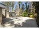 Long driveway leading to house and screened in porch. Surrounded by mature trees at 1716 N Springs Dr, Atlanta, GA 30338