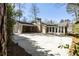 Long driveway leading to house; features a carport and screened in porch at 1716 N Springs Dr, Atlanta, GA 30338