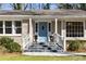 Charming home with light blue front door and inviting brick steps at 1716 N Springs Dr, Atlanta, GA 30338