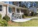 Classic brick home with a blue front door, leading to a well-manicured front yard at 1716 N Springs Dr, Atlanta, GA 30338