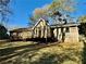 Private backyard boasts a charming deck, ideal for enjoying serene outdoor living at 3252 Westbrook Trce, Lawrenceville, GA 30044