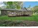House exterior featuring a wooden deck with plenty of space for outdoor seating and entertaining at 3252 Westbrook Trce, Lawrenceville, GA 30044