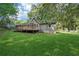 Green backyard with a wooden deck at 3252 Westbrook Trce, Lawrenceville, GA 30044