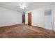 Bedroom features neutral walls, ceiling fan, and ensuite bathroom at 3252 Westbrook Trce, Lawrenceville, GA 30044