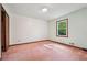 Bedroom featuring a window with green tree views and a closet for storage at 3252 Westbrook Trce, Lawrenceville, GA 30044