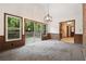 Dining room with large windows looking out to a deck and trees at 3252 Westbrook Trce, Lawrenceville, GA 30044
