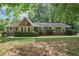 Charming single-story home with stone accents, mature trees, and well-maintained landscaping at 3252 Westbrook Trce, Lawrenceville, GA 30044