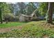 Charming house features well-maintained front yard, mature trees, and a cozy entryway at 3252 Westbrook Trce, Lawrenceville, GA 30044