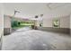 Spacious garage with two windows and an open garage door to the driveway and landscaped yard at 3252 Westbrook Trce, Lawrenceville, GA 30044