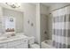 Well-lit bathroom featuring a vanity, a shower-tub combination, and stylish décor for a modern look at 3332 Old Concord Se Rd, Smyrna, GA 30082