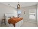 Bright bedroom featuring a platform bed with storage, stylish décor, and a unique woven pendant light at 3332 Old Concord Se Rd, Smyrna, GA 30082