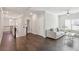 Upstairs hallway with hardwood floors leading to a living area with ample natural light at 3332 Old Concord Se Rd, Smyrna, GA 30082