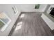 Overhead view of a sunny living room with modern floors and large windows at 5780 Bearing Way, Atlanta, GA 30349