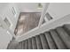 Bright living room with staircase leading to upper level of home at 5780 Bearing Way, Atlanta, GA 30349