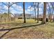 Expansive backyard featuring a wooden fence, mature trees and level ground at 81 Summer Creek Dr, Dallas, GA 30157