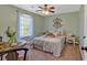 Bright bedroom featuring a decorative wall piece, a table, and carpet flooring at 81 Summer Creek Dr, Dallas, GA 30157