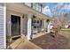 Cozy front porch with rocking chairs, hanging plants, an American flag and a welcome mat at 81 Summer Creek Dr, Dallas, GA 30157