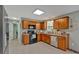 Well-lit kitchen featuring shaker cabinets, modern appliances, and plenty of counter space at 81 Summer Creek Dr, Dallas, GA 30157