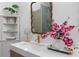 Stylish bathroom with a quartz countertop, decorative mirror, and elegant decor, creating a relaxing atmosphere at 1649 Derry Sw Ave, Atlanta, GA 30310