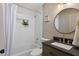 Elegant bathroom features a shower with a plant niche and modern fixtures at 1649 Derry Sw Ave, Atlanta, GA 30310