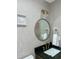 Stylish bathroom with modern fixtures, round mirror, and tasteful decor at 1649 Derry Sw Ave, Atlanta, GA 30310