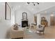 Bright living room featuring modern lighting, white walls, and hardwood flooring at 1649 Derry Sw Ave, Atlanta, GA 30310