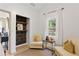 Bright sitting room area with decorative shelves, chairs, and natural light at 1649 Derry Sw Ave, Atlanta, GA 30310