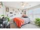 Bright bedroom boasts natural light, decorative wall art, and cozy decor accents at 2883 Misty Rock Cv, Dacula, GA 30019