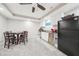 Basement kitchenette with a mini-fridge, sink, microwave, and a dining table at 2883 Misty Rock Cv, Dacula, GA 30019