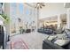 Inviting living room boasting a fireplace, soaring windows, and ample natural light and neutral color palette at 2883 Misty Rock Cv, Dacula, GA 30019