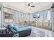 Relaxing screened porch with comfortable seating, ceiling fan, and views of the surrounding trees at 2883 Misty Rock Cv, Dacula, GA 30019