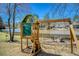 Backyard featuring a playset with a swing set and lake view with benches at 5529 Camden Lake Pointe Nw, Acworth, GA 30101