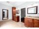Bathroom featuring and granite topped sinks, tiled floor and entrance to closet at 5529 Camden Lake Pointe Nw, Acworth, GA 30101