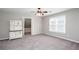 Large bedroom with ample lighting, plush carpet, and a bright window at 5529 Camden Lake Pointe Nw, Acworth, GA 30101