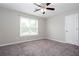 Spacious bedroom features neutral carpet, ceiling fan and sun-filled window at 5529 Camden Lake Pointe Nw, Acworth, GA 30101