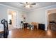 Bedroom features wood-look flooring, neutral paint, a ceiling fan, and two open doorways leading to other rooms at 5529 Camden Lake Pointe Nw, Acworth, GA 30101