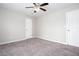 Bedroom with neutral carpet, a ceiling fan and natural light from a window at 5529 Camden Lake Pointe Nw, Acworth, GA 30101