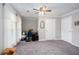 Bright bedroom with carpet, neutral walls, ceiling fan, closet space, and large window with bright natural light at 5529 Camden Lake Pointe Nw, Acworth, GA 30101