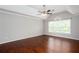 Light-filled bedroom with hardwood floors, neutral walls, and a ceiling fan at 5529 Camden Lake Pointe Nw, Acworth, GA 30101