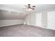 Neutral bedroom with a ceiling fan, built in desk, and plush carpet flooring at 5529 Camden Lake Pointe Nw, Acworth, GA 30101
