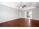 Spacious bedroom with hardwood floors, ceiling fan, and a bathroom ensuite at 5529 Camden Lake Pointe Nw, Acworth, GA 30101